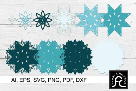 Collection of snow mandala layers in varying shades of blue, displayed on a light wooden surface for Cricut use.