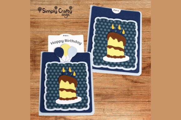 Two blue fun fold cards with cake and candles design, featuring a pull tab that reveals 'Happy Birthday' text, ideal for Cricut projects.