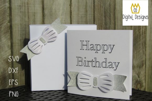 White birthday card and box with bow design, 'Happy Birthday' text on card.