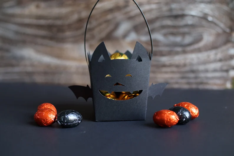Bat-shaped treat box SVG with handle for Halloween favors