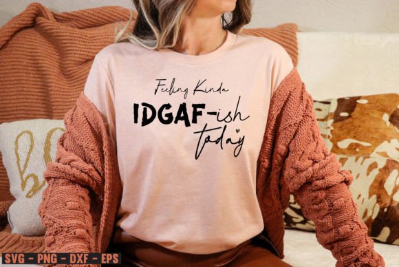 Person wearing a pink t-shirt with 'Feeling Kinda IDGAF-ish Today' in black text.