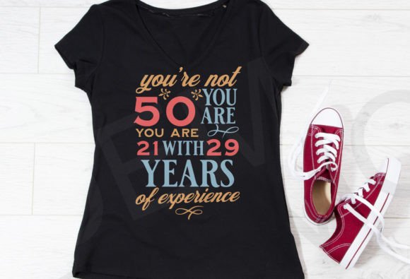 Black t-shirt with 'You're not 50, you are 21 with 29 years of experience' in colorful text.
