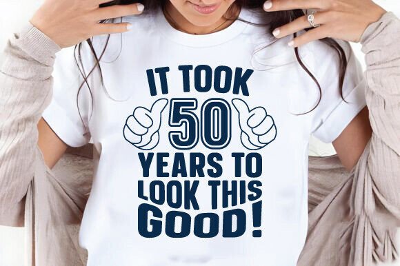White shirt with 'It Took 50 Years to Look This Good!' in bold blue text and thumbs-up graphics.