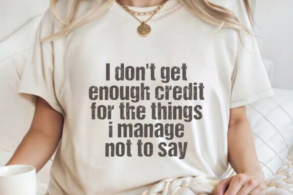 Woman wearing a white t-shirt with the text 'I don't get enough credit for the things I manage not to say.'