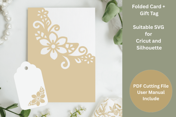 A folded card and gift tag with floral cutout designs displayed on a table.
