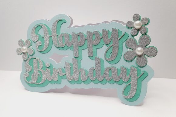 Cricut-friendly SVG design of a 'Happy Birthday' card with glittery letters and floral embellishments.