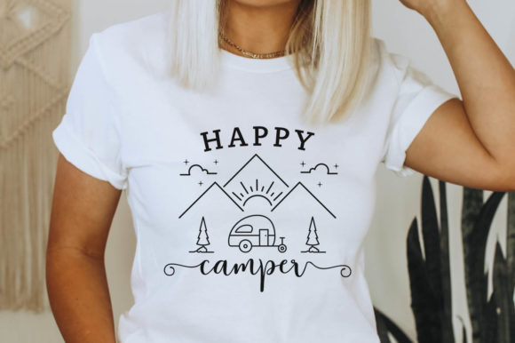 Woman wearing a t-shirt with Happy Camper SVG design featuring mountains and camper