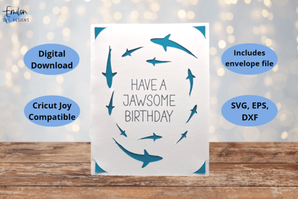 White card with blue shark silhouettes and 'Have a Jawsome Birthday' text in the center.