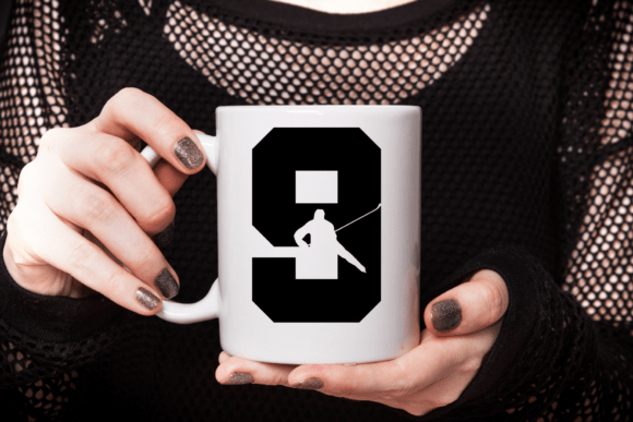 White mug featuring a large black number 9 with a hockey player silhouette inside.