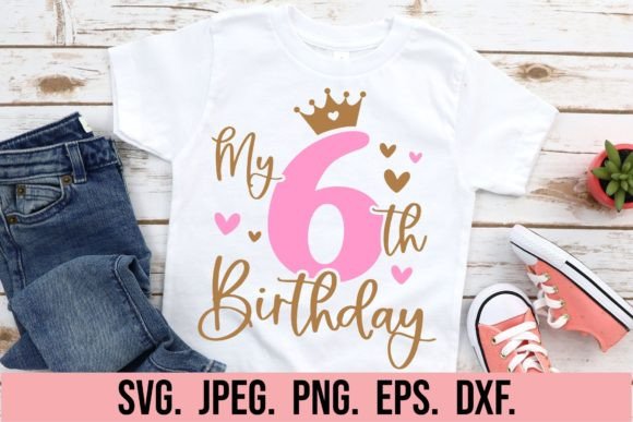 White t-shirt with 'My 6th Birthday' in pink and gold, crown and hearts design.