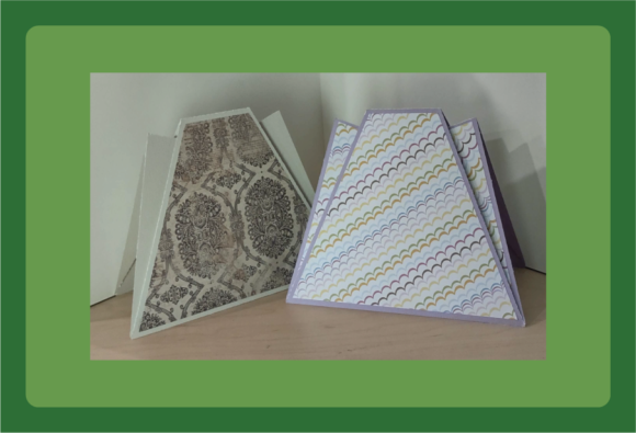 Two trapezoid-shaped cards; one with a lace pattern and the other with a pastel wave design.