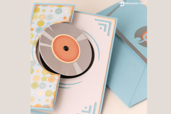 Close-up of a fun fold card SVG showing a detailed spinning record element, ideal for Cricut crafting.
