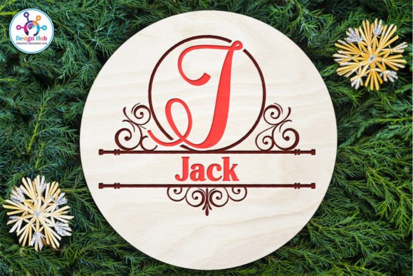 Wooden round plaque with a red ornate letter J and the name Jack, surrounded by greenery and decorative straw stars.