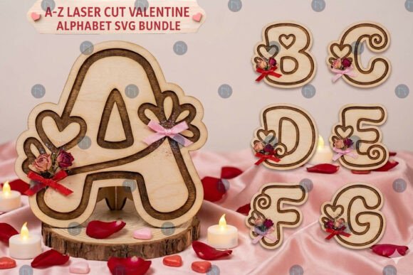 Wooden alphabet letters A, B, C, D, E, F, G with heart and rose decorations on a pink fabric background.