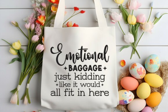 White tote bag with 'Emotional Baggage' text, surrounded by flowers and Easter eggs.