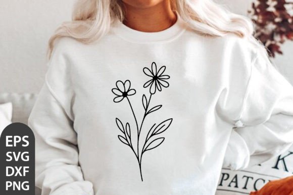 Woman wearing a white sweatshirt with a black line art floral design featuring two flowers and leaves.