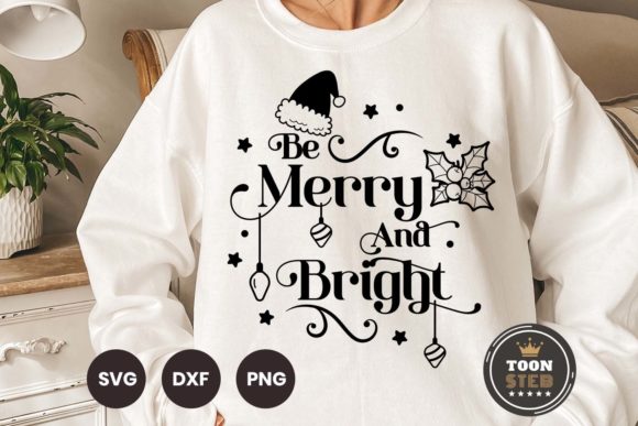 White sweatshirt with 'Be Merry and Bright' text, Santa hat, holly, ornaments, and stars.