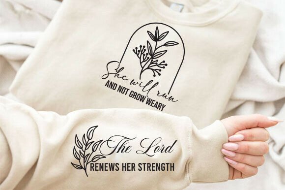 Beige sweatshirt with hand holding sleeve, showing 'She will run and not grow weary' design, sleeve text 'The Lord renews her strength'.