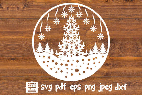 White Christmas tree with snowflakes and ornaments in a circular design on a wooden background.