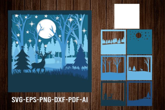 Layered papercut design with deer and forest, shown with individual layers on a wooden background.