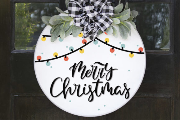 Door hanger with 'Merry Christmas' text, colorful lights, greenery, and plaid bow on a round base.