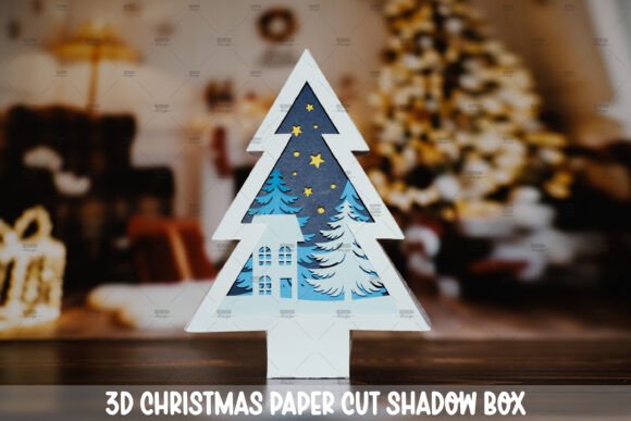 3D Christmas tree shadow box with snowy trees and stars, ideal for Cricut projects.