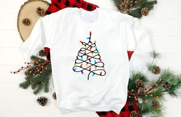 White sweatshirt featuring a Christmas tree design with colorful lights, ideal for Cricut projects.