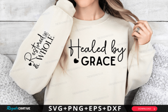 Beige sweatshirt with 'Healed by Grace' on front and 'Restored & Whole' on sleeve.