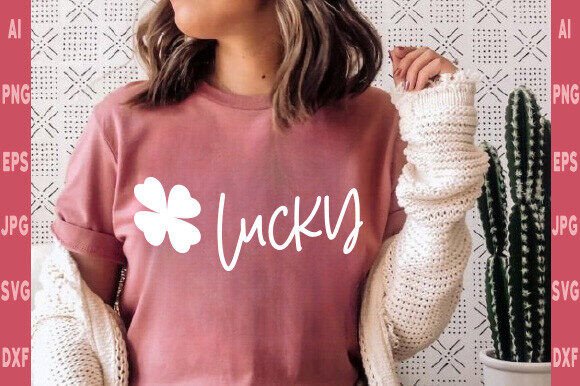 Pink t-shirt with 'Lucky' and a clover on the front.