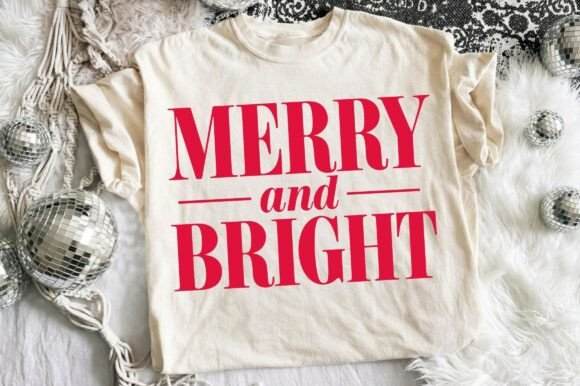 Beige t-shirt with red 'Merry and Bright' text, surrounded by silver ornaments.