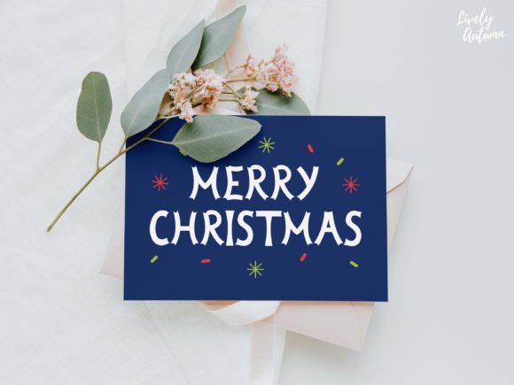 Greeting card with 'Merry Christmas' text and colorful stars, surrounded by leaves and flowers.