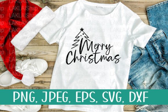 White t-shirt with 'Merry Christmas' and tree design, laid on a surface with jeans and shoes.