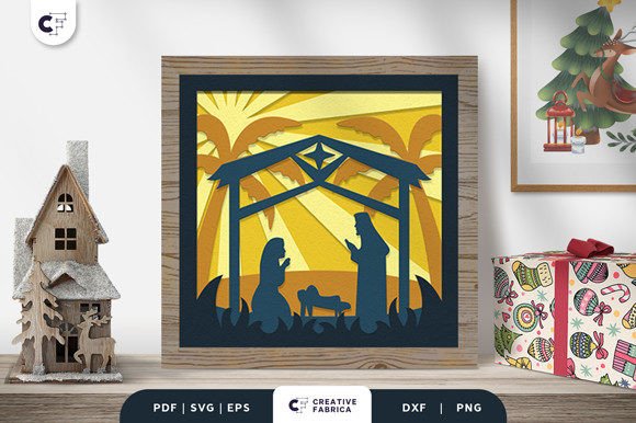 3D light box with layered nativity scene featuring Mary, Joseph, and baby Jesus under a stable, with palm trees in the background.
