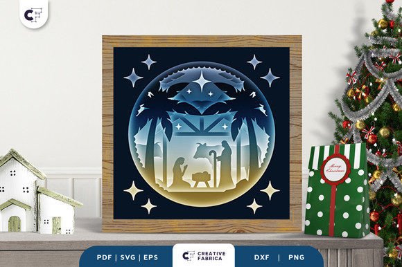 Layered nativity scene shadow box with stars, depicting Mary, Joseph, and baby Jesus under a stable.