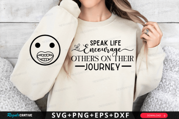 Person wearing a beige sweatshirt with 'Speak Life Encourage Others on Their Journey' text design.