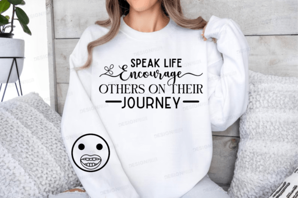 Person wearing a white sweatshirt with 'Speak Life Encourage Others on Their Journey' text design.