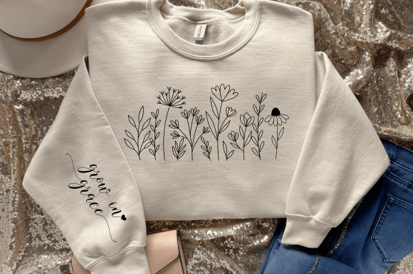 Boho floral SVG design on a sweatshirt sleeve with 'grow in grace' text, perfect for Cricut projects.