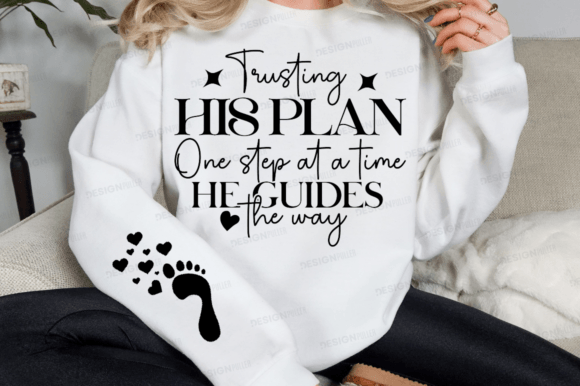 White sweatshirt featuring 'Trusting His Plan One Step at a Time He Guides the Way' with a footprint design.