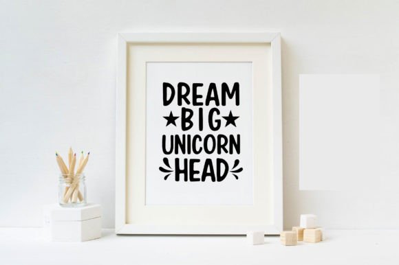 Framed print with the text 'Dream Big Unicorn Head' in a minimalist setting.